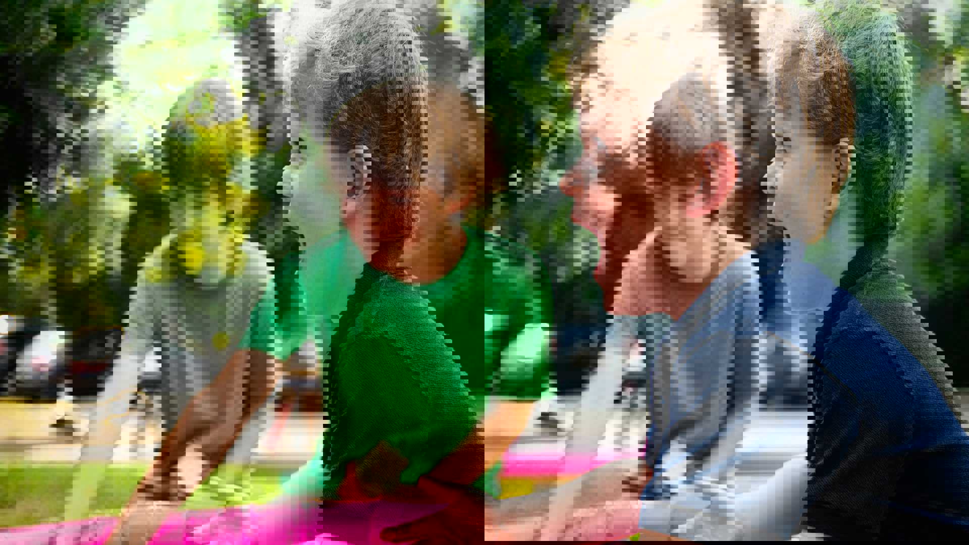 boy in blue shirt screaming near boy in green crew-neck shirt